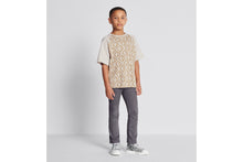 Load image into Gallery viewer, Kid&#39;s T-Shirt • Ecru Cotton Jersey with Golden Beige Spray-Effect CD Diamond Print
