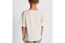 Load image into Gallery viewer, Kid&#39;s T-Shirt • Ecru Cotton Jersey with Golden Beige Spray-Effect CD Diamond Print
