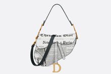 Load image into Gallery viewer, Saddle Bag with Strap • White and Black Calfskin with Newspaper Print
