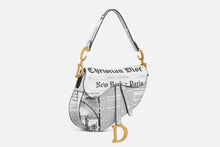 Load image into Gallery viewer, Saddle Bag with Strap • White and Black Calfskin with Newspaper Print
