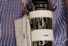 Load image into Gallery viewer, Bottle Holder with Shoulder Strap and Bottle • Off-White Grained Calfskin and Palladium-Finish Stainless Steel with Dior Oblique Motif
